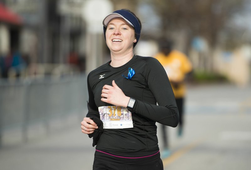 Michelle LeMaster of Olive Branch, Miss. places first in a 5K during the The 42nd annual Hogeye Marathon, Saturday, April 14, 2018 in Downtown Springdale.