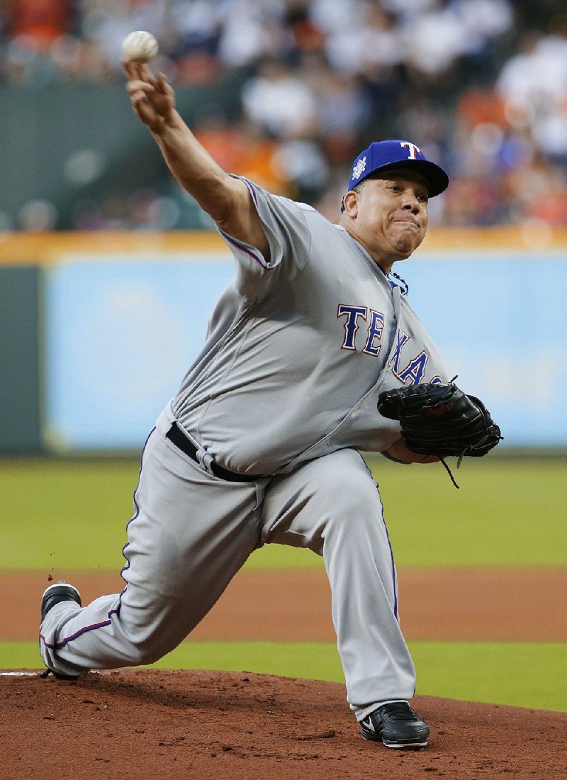 Bartolo Colon carried a perfect game into the eighth inning as the Texas Rangers survived against the Houston Astros 3-1 in 10 innings Sunday.