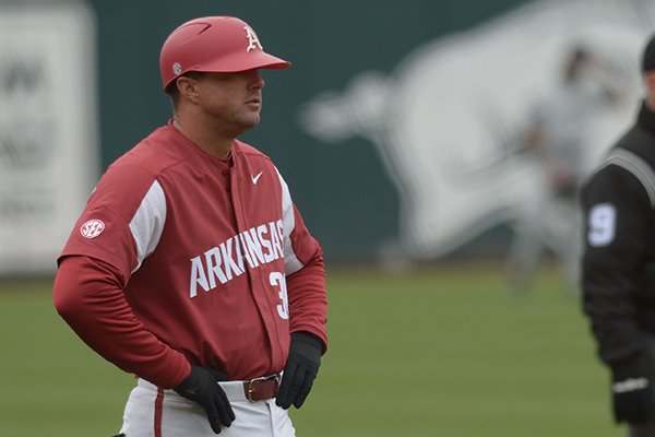 Arkansas assistant coach Nate Thompson watches from the third base coaches box against South Carolina Saturday, April 14, 2018, during the second inning at Baum Stadium.
