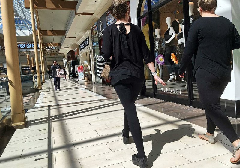 Shoppers walk through a mall in Salem, N.H., earlier this month. U.S. retail sales rebounded in March after three straight monthly declines, the Commerce Department said Monday.
