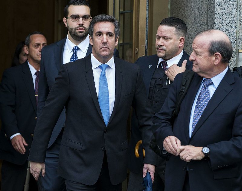 Michael Cohen, President Donald Trump’s personal attorney (center), leaves federal court after a hearing Monday in New York.