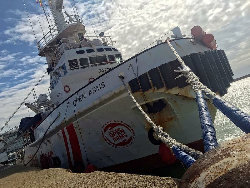 The Spanish nongovernmental organization Proactiva Open Arms vessel is seen at harbor at the port of Pozzallo, in the southern Italian island of Sicily.