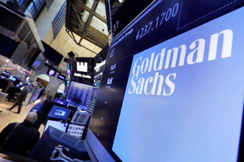 In this December 2016 file photo, the logo for Goldman Sachs appears above a trading post on the floor of the New York Stock Exchange. (AP Photo/Richard Drew, File)