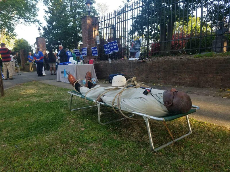 Pulaski County Circuit Judge Wendell Griffen lies on cot in front of the governor's mansion on Tuesday, April 17, 2018. 