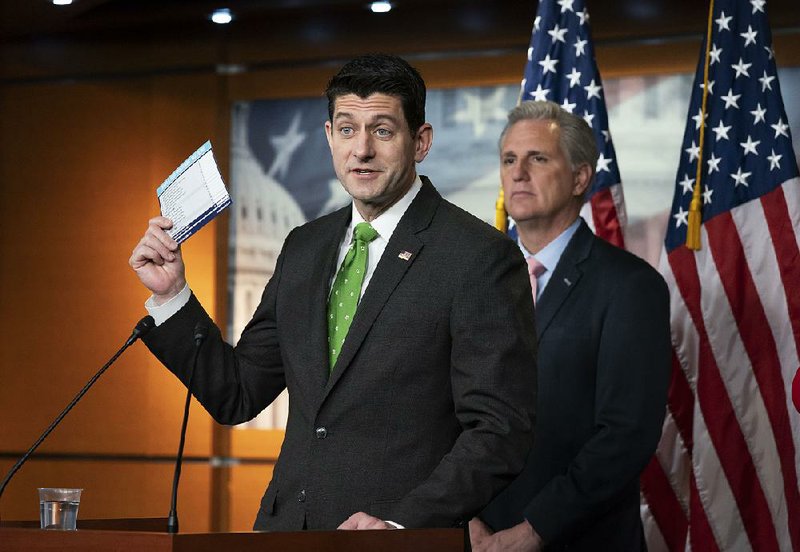 House Speaker Paul Ryan, with help from House Majority Leader Kevin McCarthy (right), uses tax day to talk about passage of the Republican tax overhaul. Ryan said the House will vote on making the individual tax cuts in the bill permanent. “Tax certainty is very important” for continued growth, he said.  