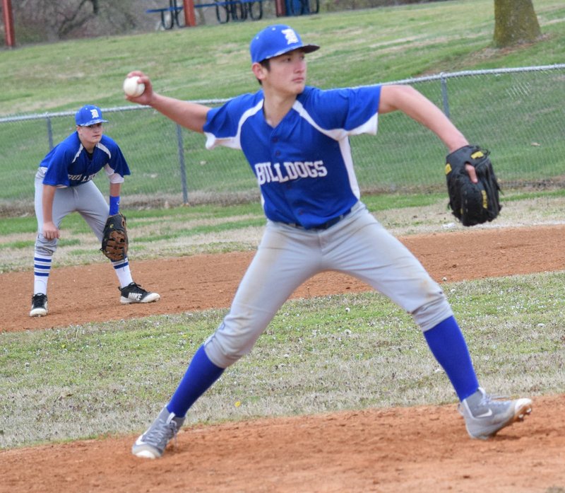 Westside Eagle Observer/MIKE ECKELS Bulldog pitcher Kevin Garcia, at the end of his windup, gets ready to deliver the ball over home plate during the Decatur-Deer conference baseball contest at Edmiston Park in Decatur April 9. The Bulldogs won the first of a doubleheader with the Antlers, 15-1. Deer forfeited the second game, giving Decatur another win.