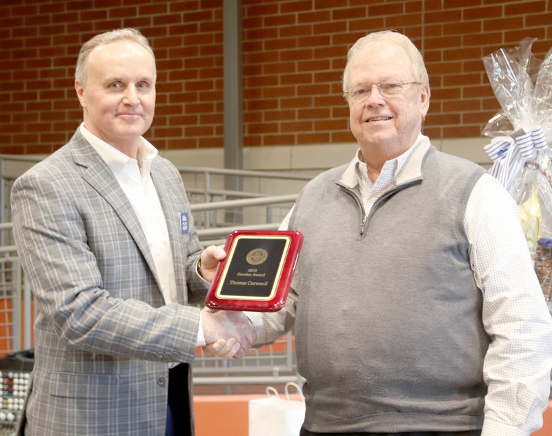 LYNN KUTTER ENTERPRISE-LEADER Mike Willard, president of Farmington Chamber board, presents an Appreciation of Service Award to Thomas Cornwell, who served on the Chamber board for about 15 years.
