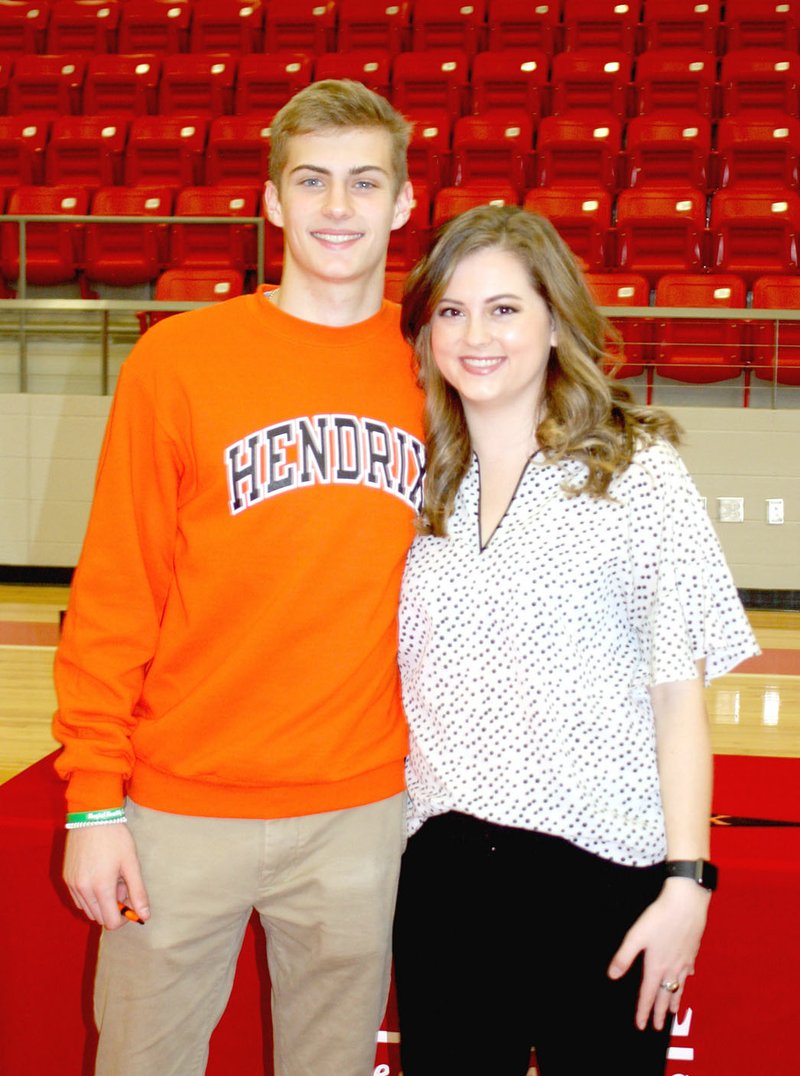 MARK HUMPHREY ENTERPRISE-LEADER Farmington senior Peyton Maxwell (left) and his sister, Haley Maxwell, a 2014 Farmington graduate, participated in a ceremony for Peyton's national letter of intent to play men's college basketball for Hendrix College, of Conway, Thursday, April 12, 2018, at Cardinal Arena. National Siblings Day was celebrated Tuesday, April 10. Both Maxwells played basketball and tennis for Farmington.