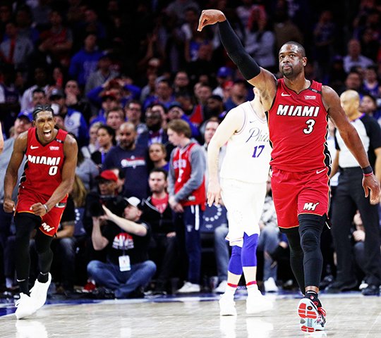 The Associated Press HEATING UP: Miami Heat's Dwyane Wade reacts to his basket in the last minute of the second half of a 113-103 Monday against the 76ers in a Philadelphia to even up their first round series in the NBA playoffs.