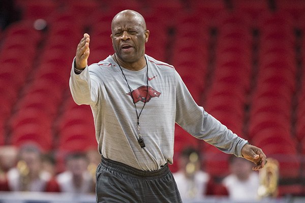Arkansas coach Mike Anderson instructs players during practice Friday, March 15, 2018, in Detroit. 