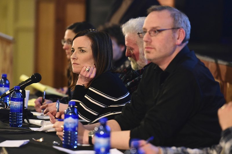 In this Jan. 8, 2018 photo, Park County School District 6 board chair Kelly Simone, center, listens to members of the community voice their opinions on Policy CKA, which would allow armed personnel in schools, during a public forum about the policy in Cody, Wyo. The Wyoming school district where the U.S. education secretary famously suggested teachers might need to carry guns to protect children from grizzly bears is about to vote whether to do just that. The Park County School District No. 6 board votes Tuesday, April 17, 2018, on allowing trained school employees to carry concealed firearms. 