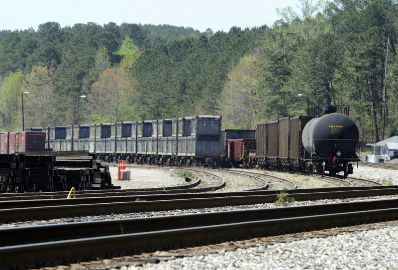 This April 12, 2018 photo shows containers that were loaded with tons of sewage sludge in Parrish, Ala. More than two months after the so-called "Poop Train" rolled in from New York City, Hall says her small town smells like rotting corpses. Some say the trainloads of New Yorkers' excrement is turning Alabama into a dumping ground for other states' waste. 