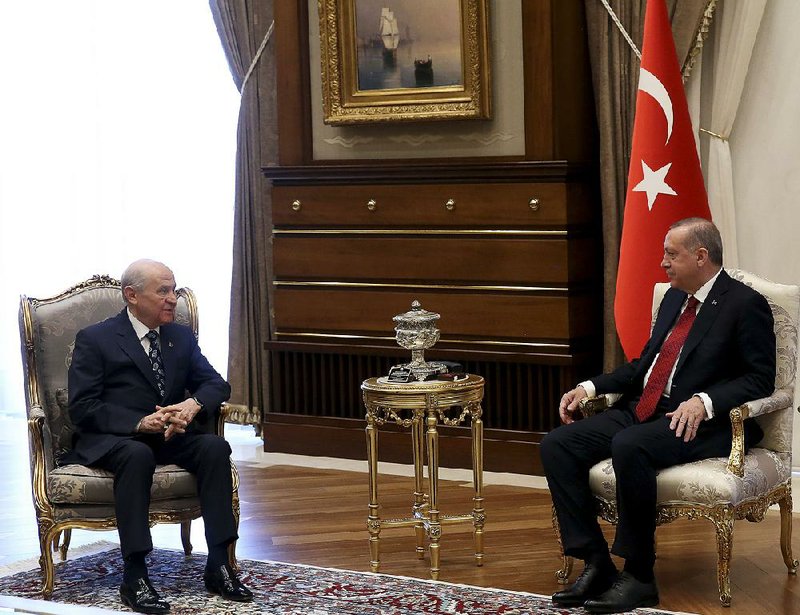 Turkish President Recep Tayyip Erdogan (right) meets Wednesday with political ally Devlet Bahceli in Ankara to discuss early elections.  