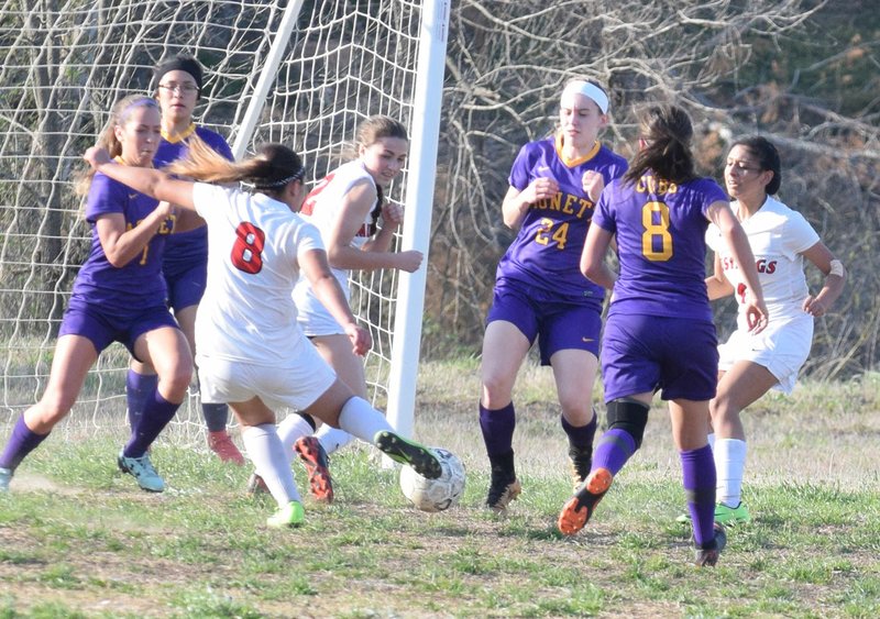 RICK PECK/SPECIAL TO MCDONALD COUNTY PRESS McDonald County's Nautica Gutierrez (8) shoots during the Lady Mustangs' 2-1 loss to the Monett on April 12 at MCHS. Gutierrez's shot got blocked but teammate Azlen Smith (2) was there to knock in the rebound.