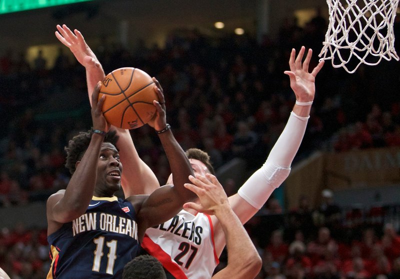 The Associated Press HOLIDAY TIME: New Orleans Pelicans guard Jrue Holiday, left, shoots next to Portland Trail Blazers center Jusuf Nurkic during the first half of Tuesday's first-round playoff game in Portland, Ore. Holiday finished with 33 points to lead the Pelicans to a 2-0 lead over Portland.