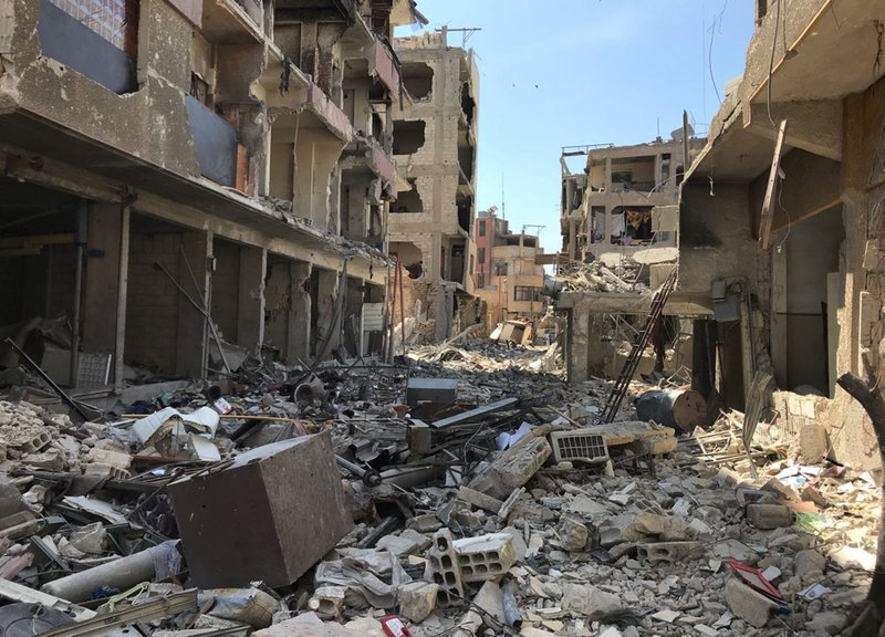 Rubble fills a street in Douma, the site of a suspected chemical weapons attack, near Damascus, Syria, Monday, April 16, 2018. Faisal Mekdad, Syria's deputy foreign minister, said on Monday that his country is &quot;fully ready&quot; to cooperate with the fact-finding mission from the Organization for the Prohibition of Chemical Weapons that's in Syria to investigate the alleged chemical attack that triggered U.S.-led airstrikes. (AP Photo/Hassan Ammar)