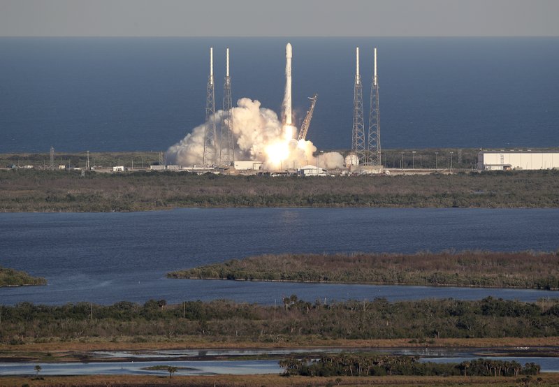 A SpaceX Falcon 9 rocket transporting the Tess satellite lifts off from launch complex 40 at the Cape Canaveral Air Force Station in Cape Canaveral, Fla., Wednesday, April 18, 2018. The satellite known as Tess will survey almost the entire sky, staring at the brightest, closest stars in an effort to find any planets that might be encircling them. (AP Photo/John Raoux)