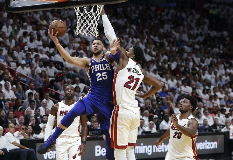 Ben Simmons (25) of the Philadelphia 76ers drives against Hassan Whiteside of the Miami Heat during the 76ers’ 128-108 victory in Game 3 of their NBA playoff series Thursday night.