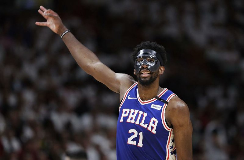 Joel Embiid (above) scored 23 points in his return as the Philadelphia 76ers defeated the Miami Heat 128-108 in Game 3 of their NBA playoff series Thursday night in Miami
