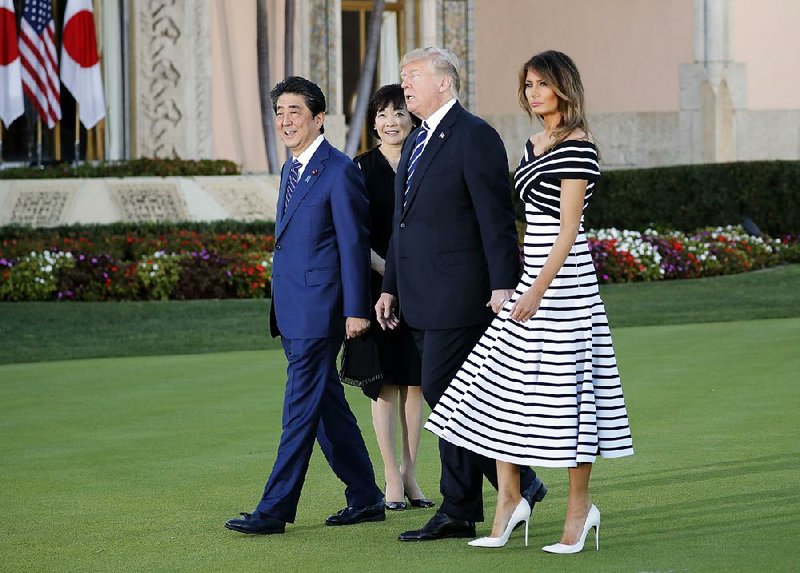 Japanese President Shinzo Abe and his wife, Akie, walk with President Donald Trump and Melania Trump at Trump’s Mar-a-Lago estate Tuesday in Palm Beach, Fla. Despite appearances, the leaders’ trade talks during the Florida visit were tense, tough and resulted in little progress, according to two U.S. officials. 
