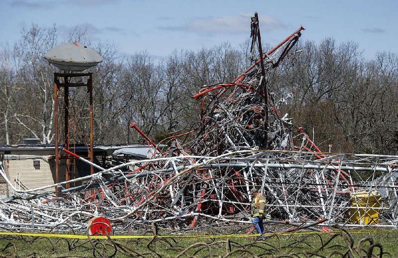 The 1,980-foot tall communications tower collapsed into a tangle of metal Thursday in Fordland, Mo. 