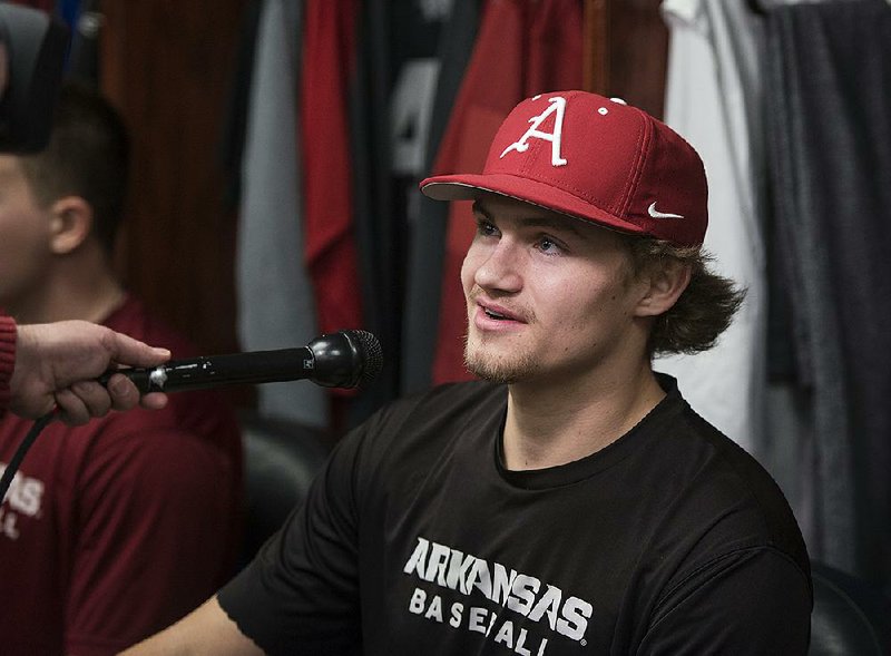 Jake Reindl, Arkansas right hand pitcher, takes questions Saturday, Jan. 27, 2018, in the locker room during Arkansas baseball media day at Baum Stadium in Fayetteville. 