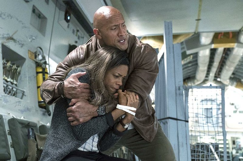 Naomie Harris stars as Dr. Kate Caldwell and Dwayne Johnson as Davis Okoye in the new action adventure film Rampage. It came in first at last weekend’s box office and made about $35.7 million. 