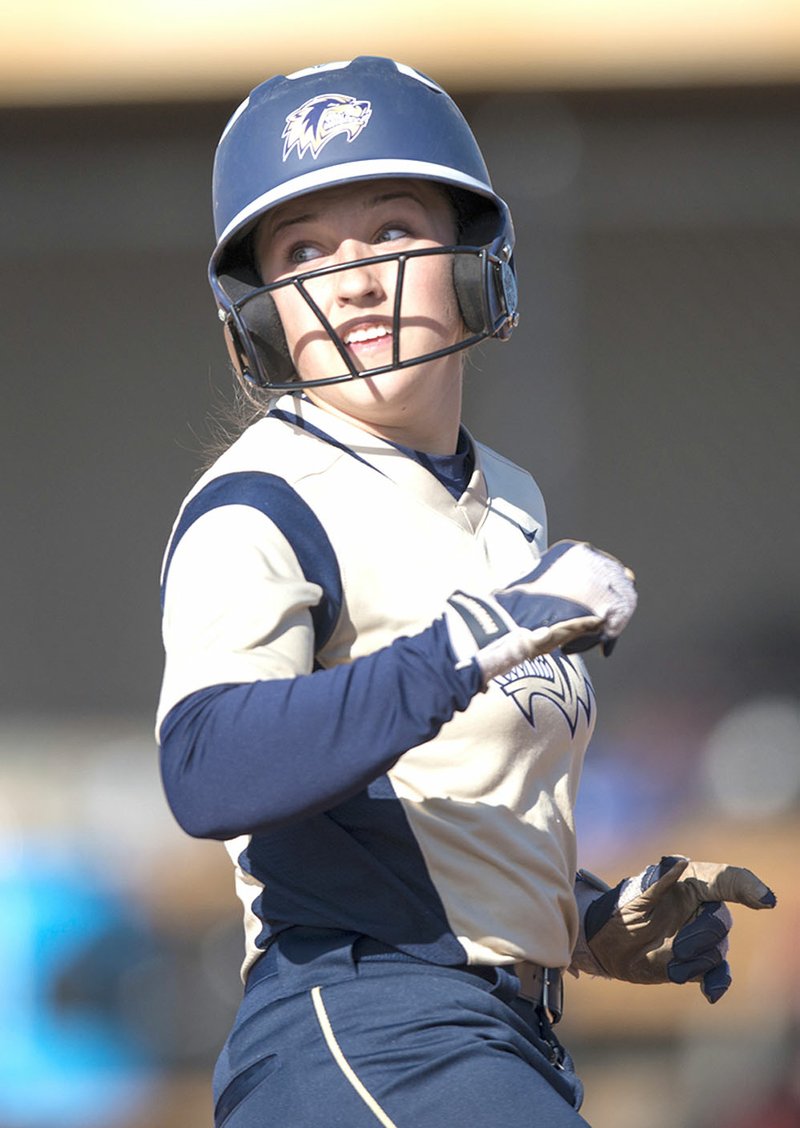 Bentonville West’s Hallie Wacaser (1) looks back as she heads for third base Thursday during a game against Springdale High in Centerton.