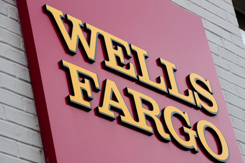 This file photo shows a sign at a Wells Fargo bank location in Philadelphia. (AP Photo/Matt Rourke, File)