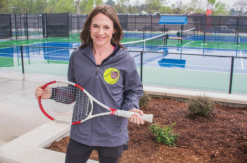 Hannah Howell stands in the new $2.6 million Conway Tennis Complex in Laurel Park on Prince Street. Howell, who is president of the Conway Area Tennis Association, said she’d never played the sport until four years ago. The eight-court tennis complex, which opened last week, is a game-changer in Conway, she said.