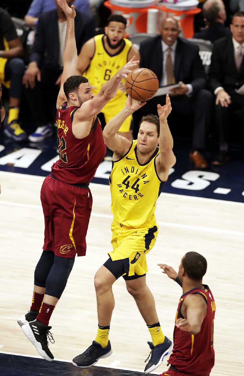 Bojan Bogdanovic (44) of the Indiana Pacers passes around Larry Nance Jr. of the Cleveland Cavaliers during Game 3 of their NBA playoff series Friday night. Bogdanovic scored 30 points in the Pacers’ 92-90 victory. 