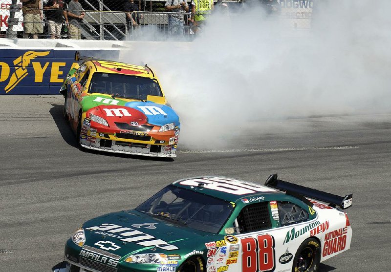 Kyle Busch (top) took out fan favorite Dale Earnhardt Jr. (88) as they were battling for the lead at Richmond Raceway in 2008, cementing his reputation as NASCAR’s new villain. For the rest of the season, Busch said, he received death threats and had constant protection. 