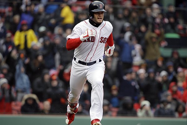 Boston Red Sox's Andrew Benintendi runs after hitting an RBI-triple, allowing Jackie Bradley Jr. to score, in the fifth inning of a baseball game against the Baltimore Orioles, Sunday, April 15, 2018, in Boston. (AP Photo/Steven Senne)

