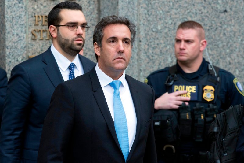 n a Monday, April 16, 2018, file photo, Michael Cohen, President Donald Trump's personal attorney, center, leaves federal court, in New York. Federal prosecutors said they can give President Donald Trump's personal lawyer, Cohen, copies of materials seized from him by the FBI by May 11. They notified a New York judge Wednesday. (AP Photo/Mary Altaffer, File)