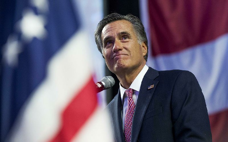 U.S. Senate candidate Mitt Romney speaks Saturday at the Utah Republican convention in West Valley City. 
