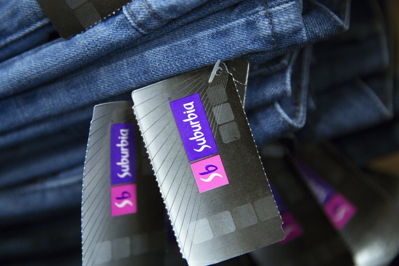 Tags hang from a pair of blue jeans at a Wal-Mart de Mexico Suburbia department store in Mexico City on Oct.17, 2014. MUST CREDIT: Bloomberg photo by Susana Gonzalez.