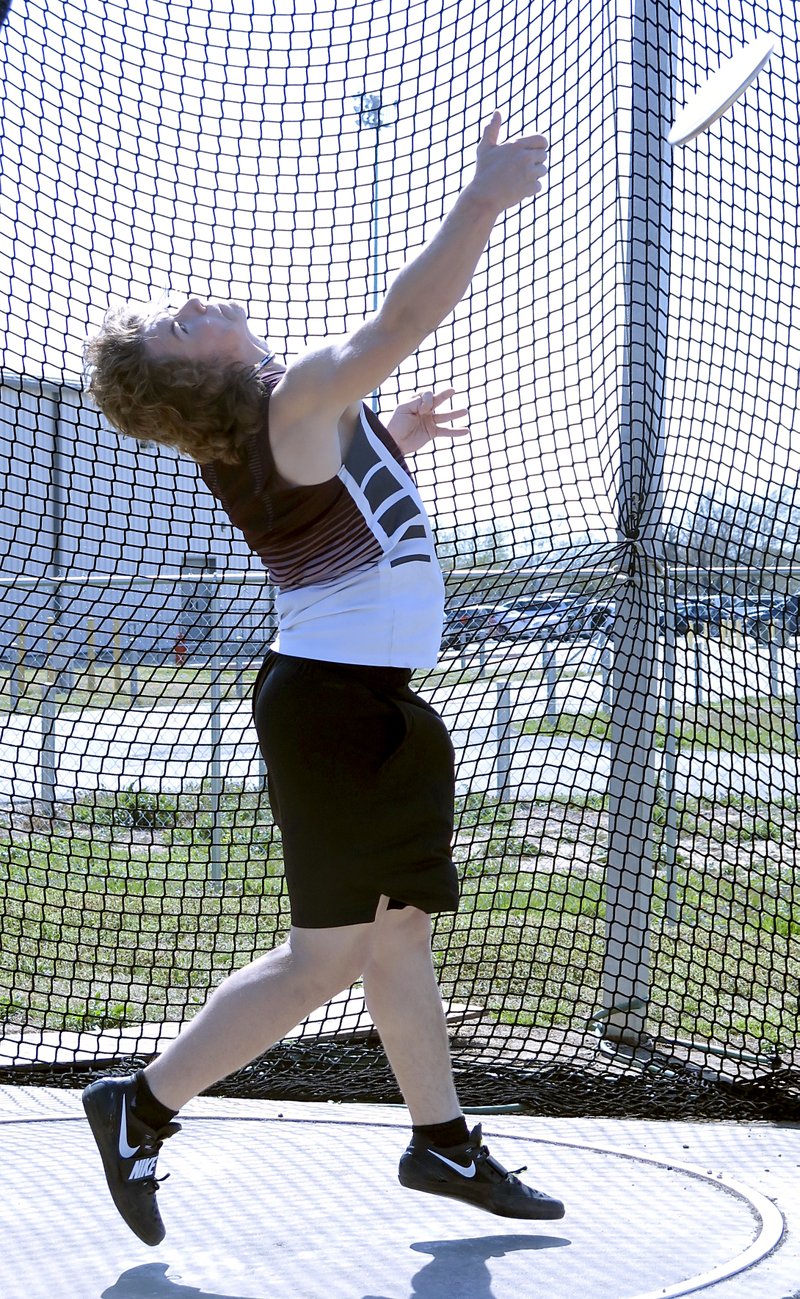 Westside Eagle Observer/RANDY MOLL Gentry senior Mason Clark throws the discus during the Pioneer Relays at Gentry High School on Thursday, April 12, 2018.