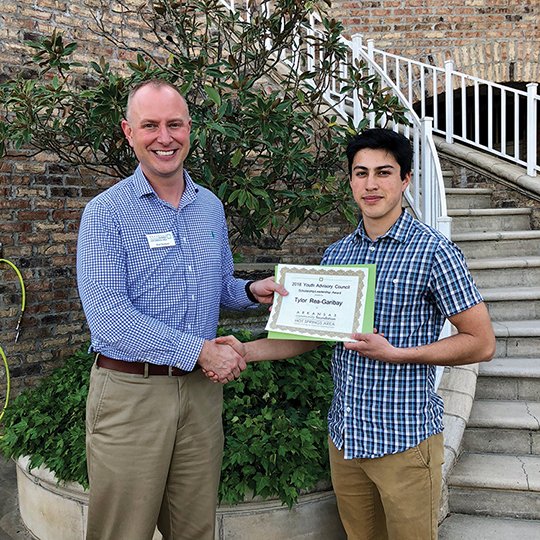 Submitted photo SCHOLAR: Scholarship recipient Tylor Rae-Garibay with Brad Burleson, lead Youth Advisory Council adviser, at Wednesday's award ceremony at Hot Springs Country Club.