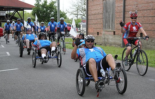 The Wounded Warrior Project finished an over 10 mile bike through Hot Springs ending at the Farmer's Market on Saturday April 21. The group biked over 25 miles in the two-day trek through town. (Rebekah Hedges/The Sentinel-Record)