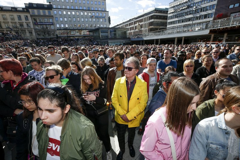 Fans of Dj Avicii gather for a minute's silence in his honour, at Sergels Torg in central Stockholm, Sweden, Saturday, April 21, 2018. Avicii, the Grammy-nominated electronic dance DJ who performed sold-out concerts for feverish fans around the world and also had massive success on U.S. pop radio, died Friday. He was 28. (Fredrik Persson/TT New Agency via AP)