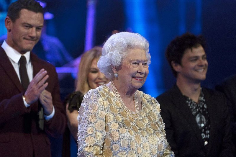 Queen Elizabeth II smiles on stage at the Royal Albert Hall in London on Saturday April 21, 2018, for a concert to celebrate her 92nd birthday. (David Mirzoeff/Pool via AP)
