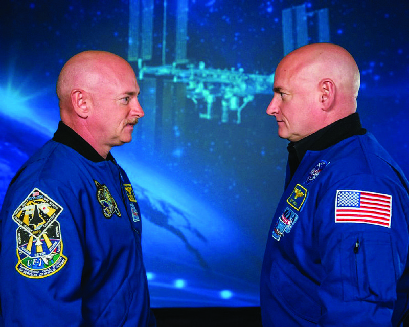 The commander of Expedition 45/46, Astronaut Scott Kelly (right), squares off with his twin, former astronaut Mark Kelly, at the Johnson Space Center on Dec. 17, 2015.
