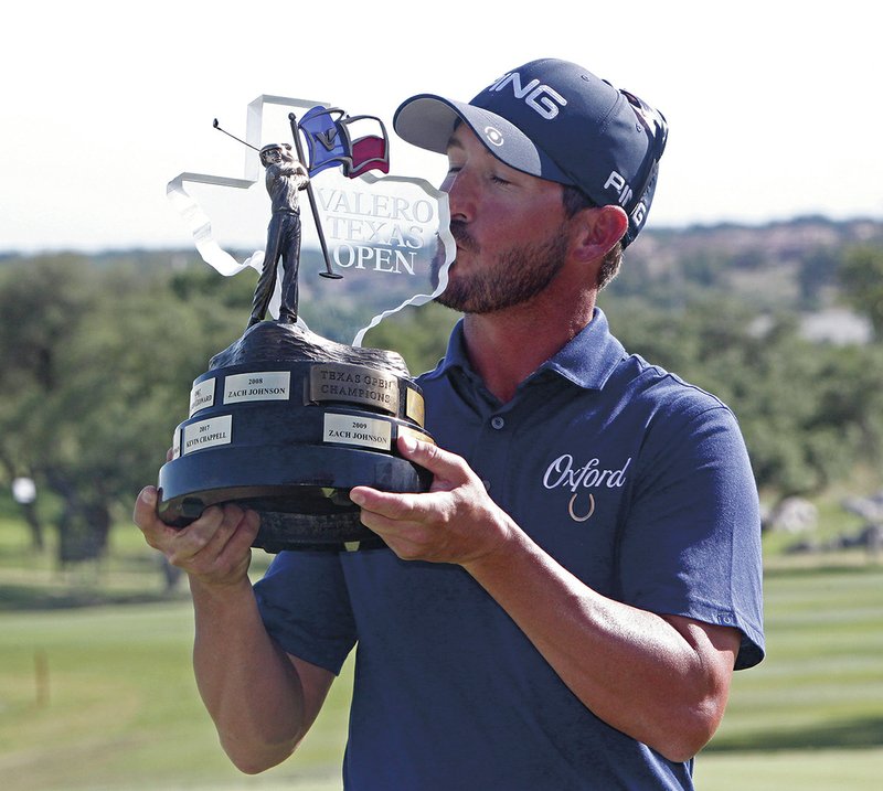 Andrew Landry kisses the trophy for the Valero Texas Open, Sunday, April 22, 2018, in San Antonio. Landry won with a score of 17 under par. (AP Photo/Michael Thomas)