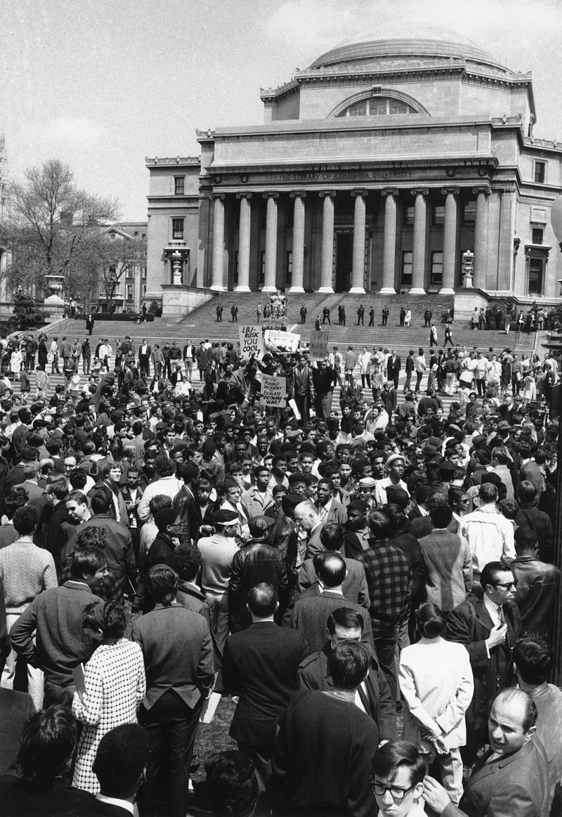 In this April 27, 1968 file photo, demonstrators and students protest at the plaza in front of Columbia University's Low Memorial Library in New York. Fifty years ago, students occupied five buildings at the university and shut down the Ivy League campus in a protest over the school's ties to a military think tank and what protesters saw as racism toward Columbia's Harlem neighbors. More than 700 protesters were arrested and more than 130 were injured when police retook the occupied buildings, during what was part of a year of global turmoil. (AP Photo, File)