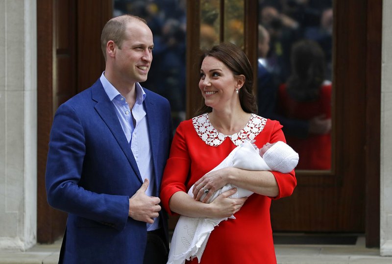 Britain's Prince William and Kate, Duchess of Cambridge pose for a photo with their newborn baby son as they leave the Lindo wing at St Mary's Hospital in London London, Monday, April 23, 2018. The Duchess of Cambridge gave birth Monday to a healthy baby boy — a third child for Kate and Prince William and fifth in line to the British throne. (AP Photo/Kirsty Wigglesworth)