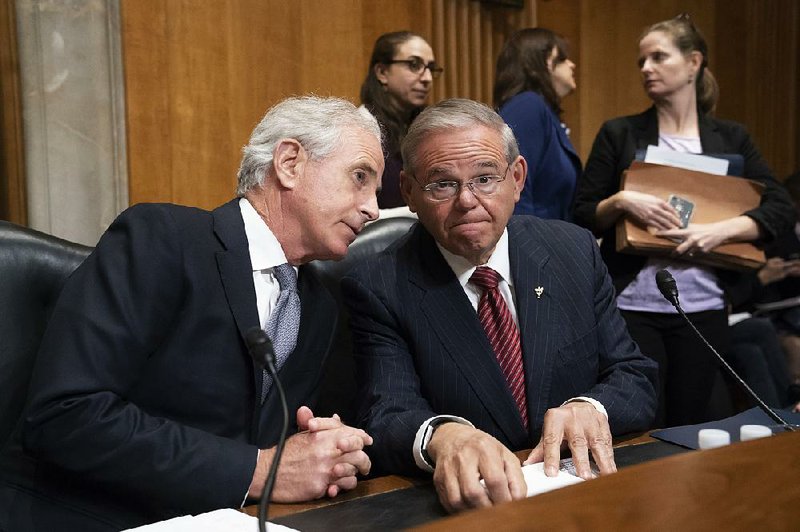 Senate Foreign Relations Committee Chairman Bob Corker (left), R-Tenn., and Sen. Robert Menendez, D-N.J., oversee the vote on President Donald Trump’s nominee for secretary of state, Mike Pompeo, who has faced considerable opposition before the panel, Monday on Capitol Hill. 

