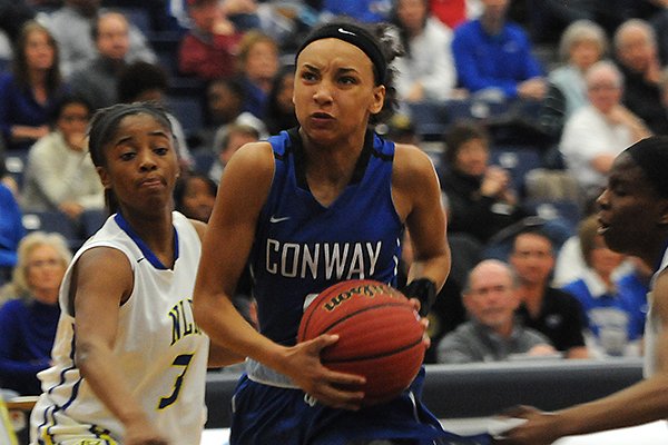 Conway's Alexis Tolefree drives to the basket during a game against North Little Rock on Monday, March 9, 2015, during the Class 7A semifinals at Har-Ber High School in Springdale. 