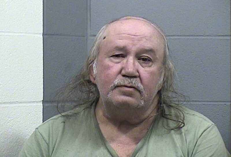 In this photo provided by the Harvey County Kansas Sheriff's Office, Ronnie Busick is pictured in a booking photo in Newton, Kansas. Craig County, Oklahoma District Attorney Matt Ballard has said Busick is charged with four counts of first-degree murder, two counts of kidnapping and one count of first-degree arson in the 1999 deaths of a couple in Welch, Okla., and the abduction of two teenage girls who remain missing. (Harvey County Kansas Sheriff's Office via AP)

