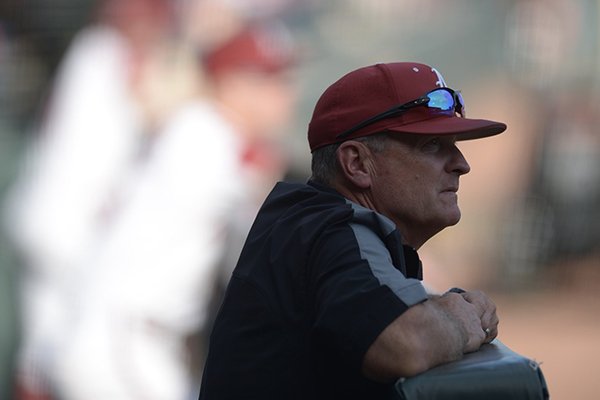 Arkansas coach Dave Van Horn watches from the dugout prior to a game against Texas Tech on Tuesday, April 24, 2018, in Fayetteville. 