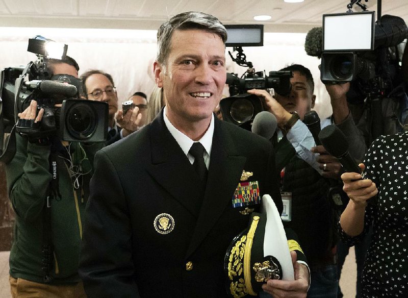 Rear Adm. Ronny Jackson, President Donald Trump's choice to be secretary of the Department of Veterans Affairs, leaves a Senate office building after meeting individually with some members of the committee that would vet him for the post, on Capitol Hill in Washington, Tuesday, April 24, 2018.  